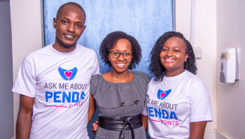 Two Penda Health staff and a guest at the Penda Points Loyalty Program Launch